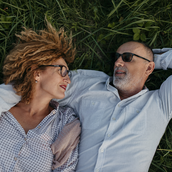 Couple laying on Grass